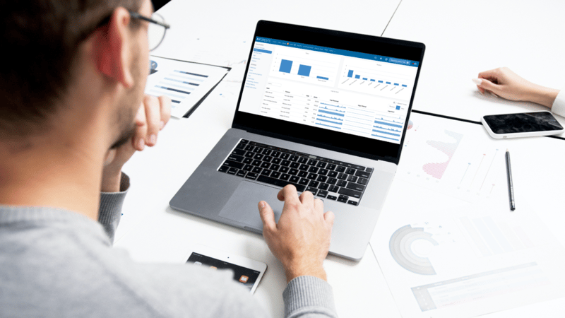man using laptop with device log on screen
