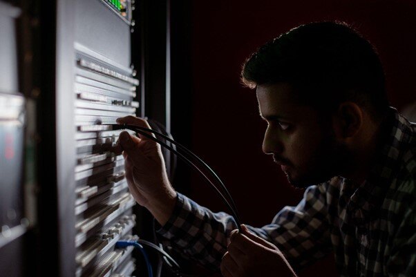 man working on server switch