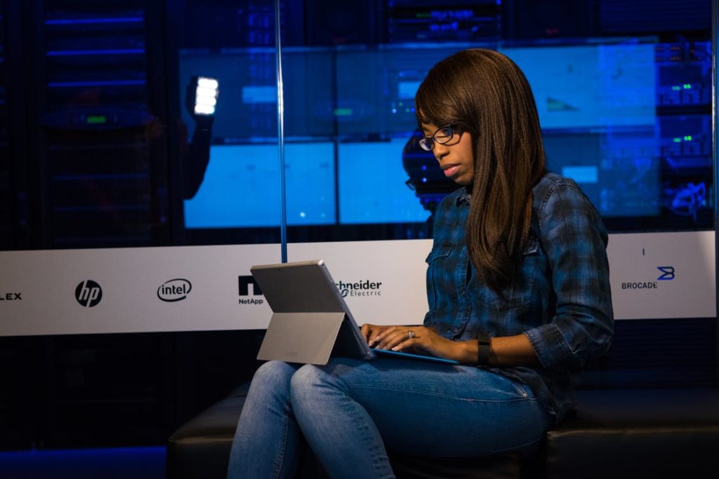 woman on computer in dark area