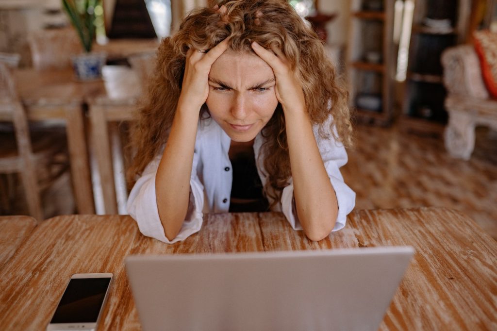 woman frustrated at laptop